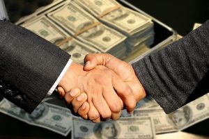 Handschlag und Dollar
